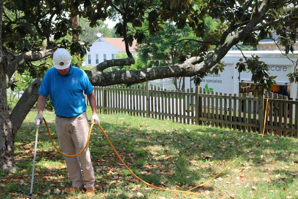 RTEC employee applying fall bio-stimulant