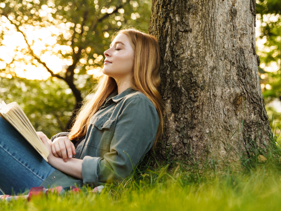 Woman under tree reading