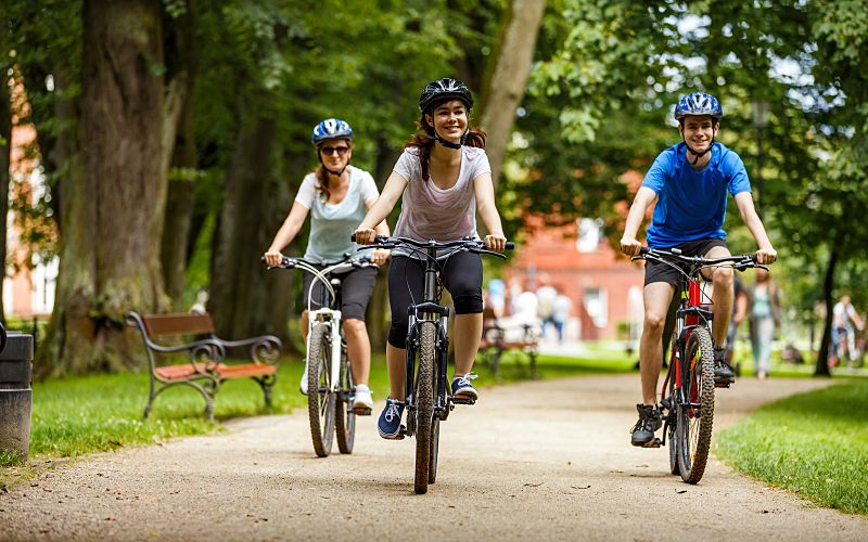 people riding bikes in the park