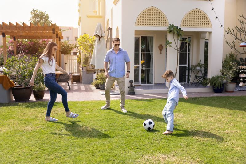 Happy family playing in backyard