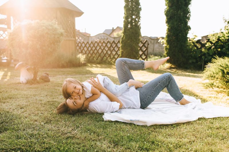 mother and daughter enjoying mosquito free yard