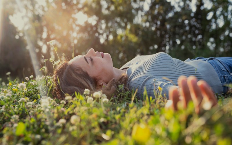 relaxed woman in the grass